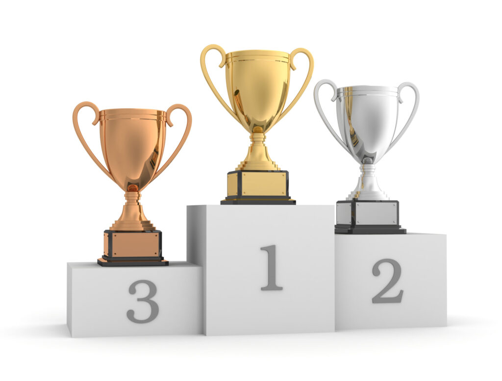 awards on winner podium 3d illustration on white background