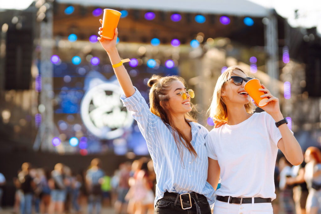 two girls having fun at a music festival