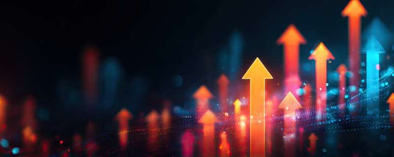 Abstract glowing upward arrows in orange and blue hues against a dark background, suggesting growth, progress, and positive trends in a digital or financial context