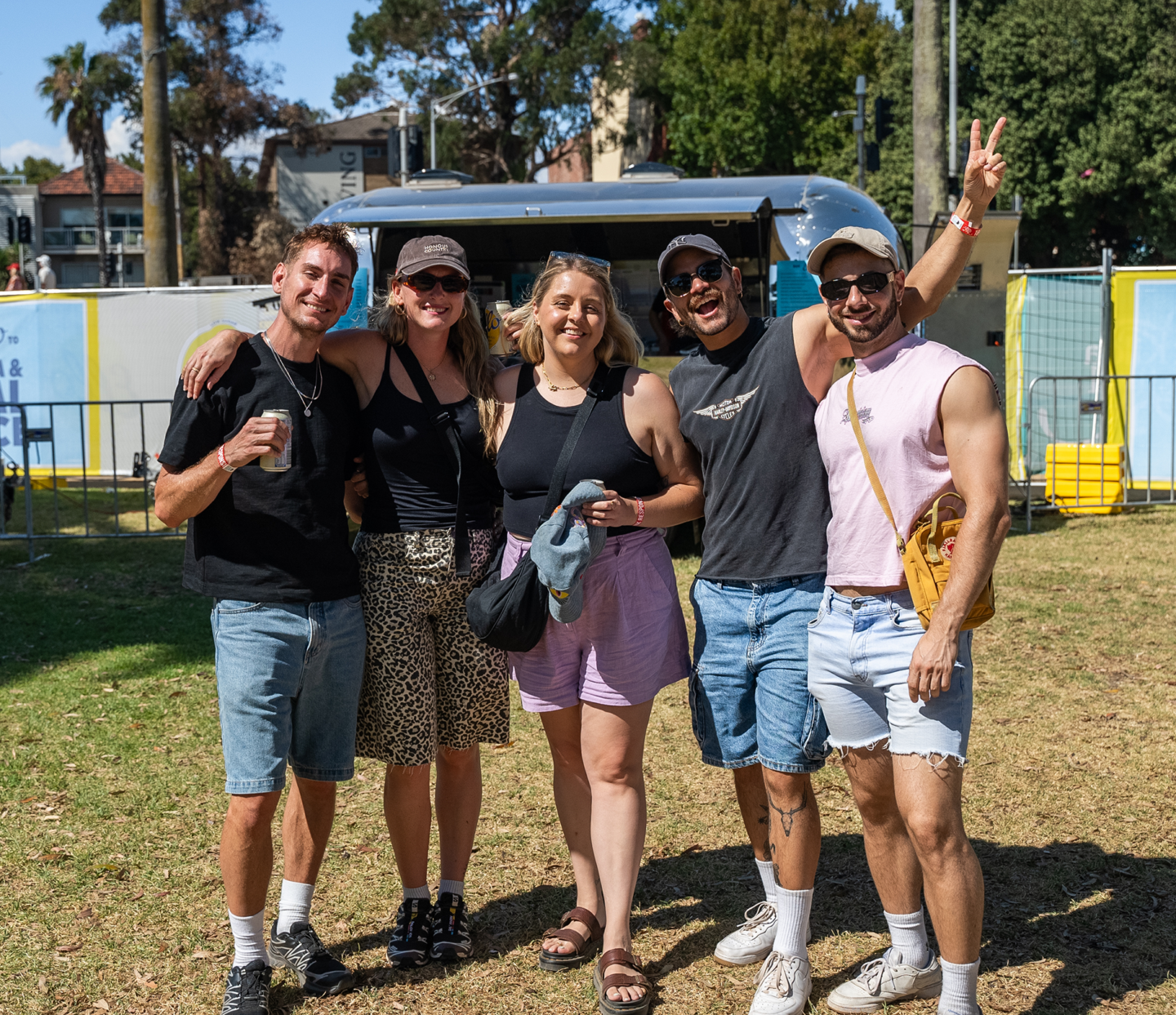 group of attendees at a festival smiling - st kilda festival