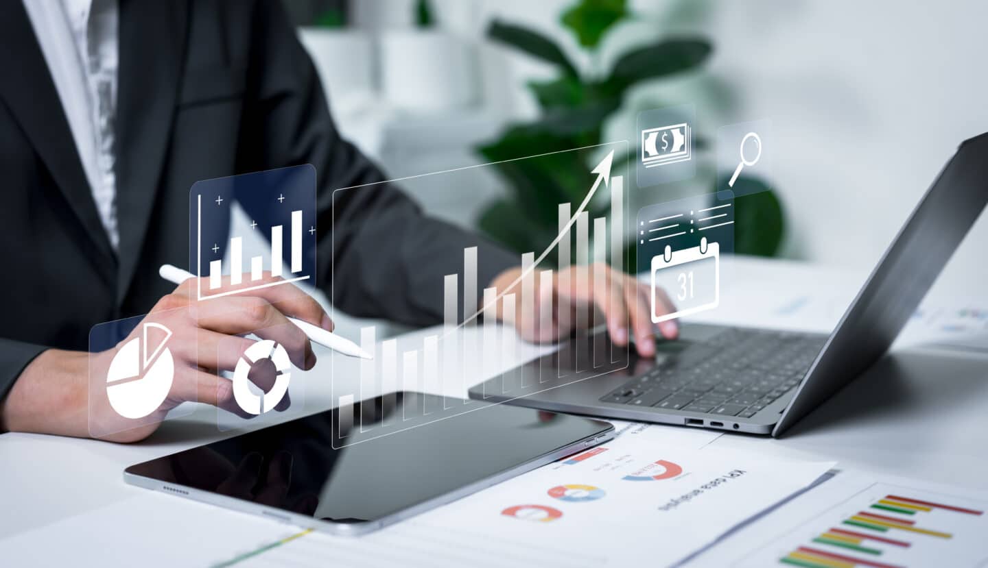 Businessman analyzing financial charts with business intelligence concept, banking analytics, market canvassing, data driven insights and corporate finance strategy.