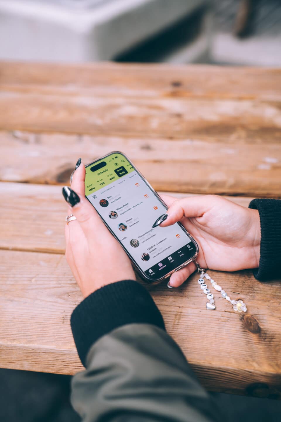 fan scrolling through festival schedule on event mobile app