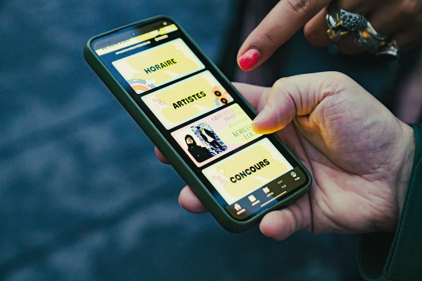 two fans looking at festival event mobile app