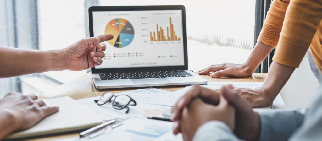 Business team collaboration discussing working analyzing with financial data and marketing growth report graph in team, presentation and brainstorming to strategy planning making profit of company.