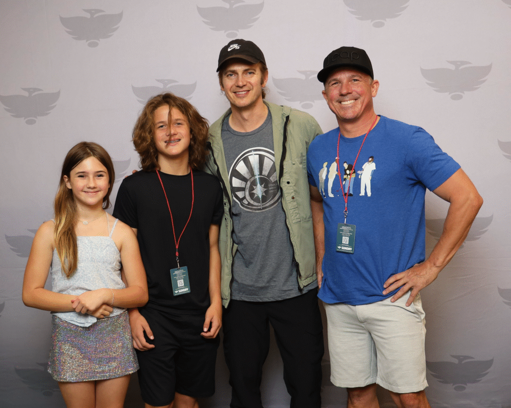 mike posing with his kids at a Star Wars celebrity photo op